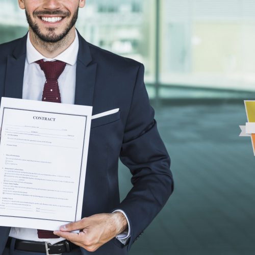 close-up-smiley-lawyer-holding-contract